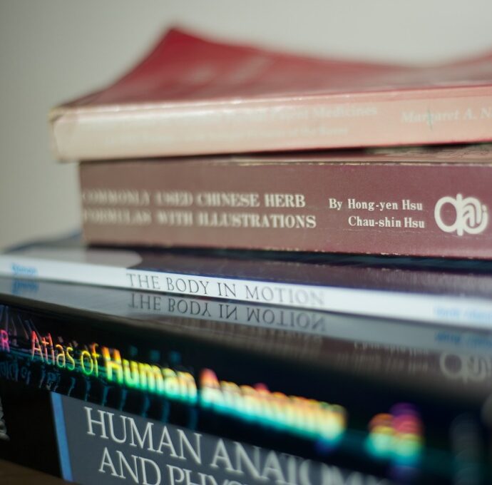 books about body work stacked